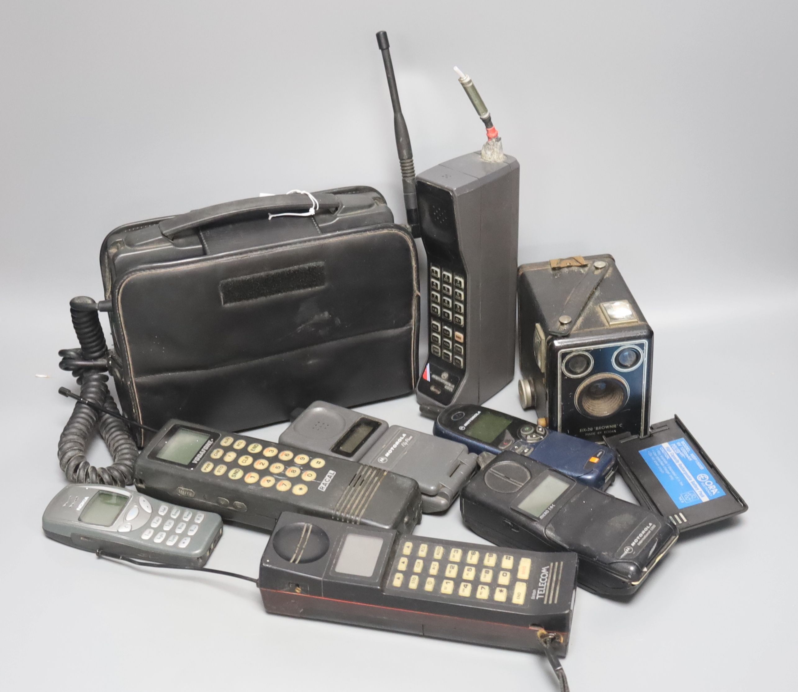 Eight early/retro mobile phones and a Box Brownie